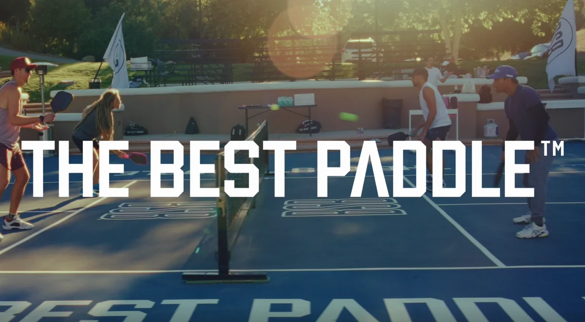 Pickleball players rallying on a blue outdoor court at golden hour, with The Best Paddle title text